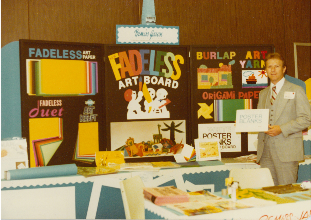 Bob at an educational trade show showing off Fadeless fade resistant bulletin board paper.