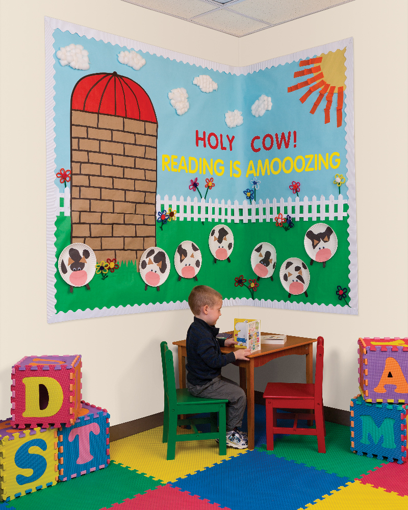 Child reading in a decorated reading corner